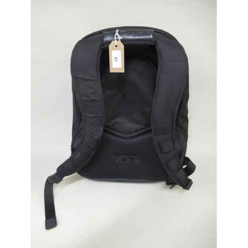 67 - Tumi, black backpack (split to handle)