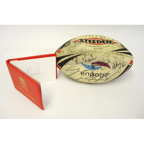 84 - Small red Wigan rugby league autograph book containing a quantity of various autographs, together wi... 