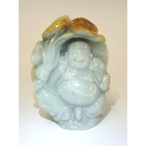 88 - 20th Century two colour celadon jade figure of a standing Buddha, 11cm high approximately