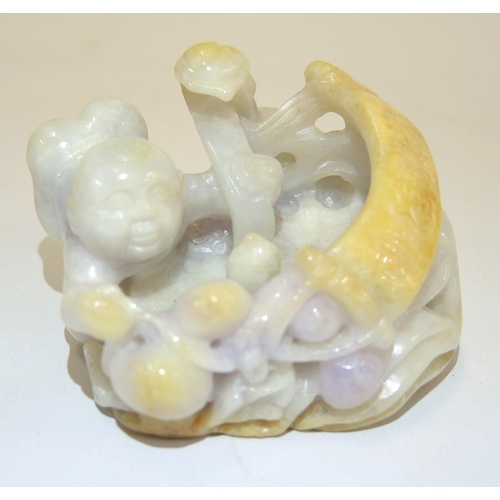 89 - Small 20th Century deep relief multi coloured jade group of a crawling figure with a scroll, 7.5cm x... 