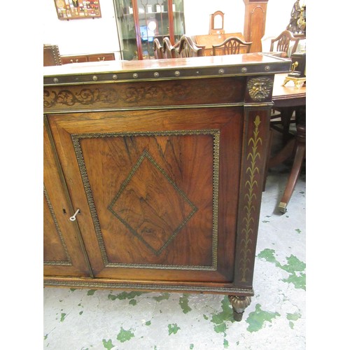 1624 - Pair of Regency rosewood and cut brass inlaid two door side cabinets, each with a brassbound and cro... 