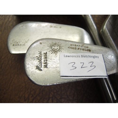 323 - Seven various hickory shafted golf clubs