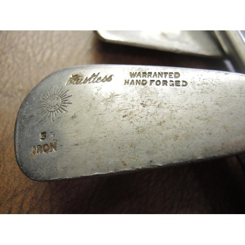 323 - Seven various hickory shafted golf clubs