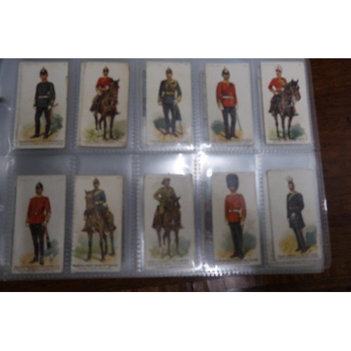 254 - Two albums containing a collection of various scarce cigarette cards in mixed condition and an album... 