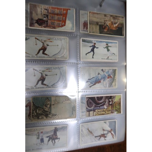 254 - Two albums containing a collection of various scarce cigarette cards in mixed condition and an album... 