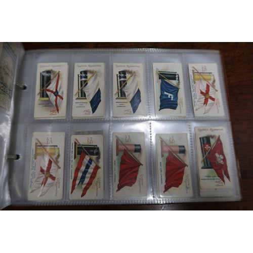 254 - Two albums containing a collection of various scarce cigarette cards in mixed condition and an album... 