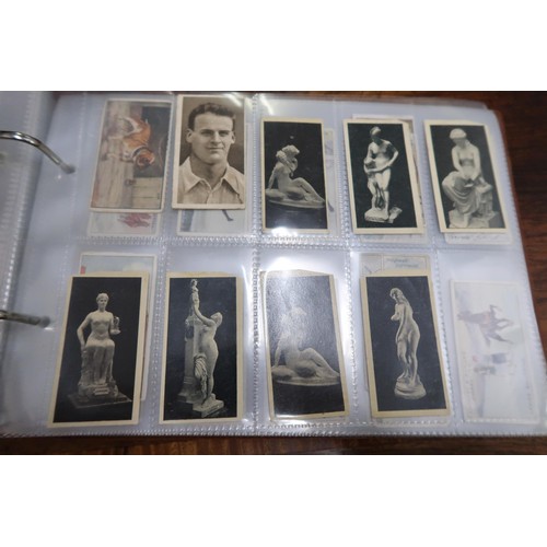 254 - Two albums containing a collection of various scarce cigarette cards in mixed condition and an album... 