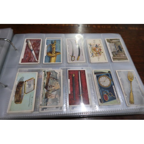 254 - Two albums containing a collection of various scarce cigarette cards in mixed condition and an album... 