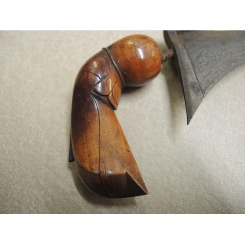 211 - Indonesian hardwood handled kris with wooden sheath, together with another bone handled and brass mo... 