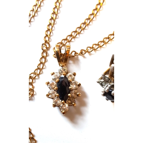 1025 - 9ct Gold blue and white stone pendant on a 9ct gold chain, together with a pair of 9ct gold diamond ... 