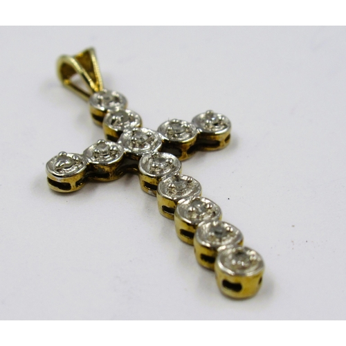 1051 - 9ct Yellow gold diamond set pendant cross