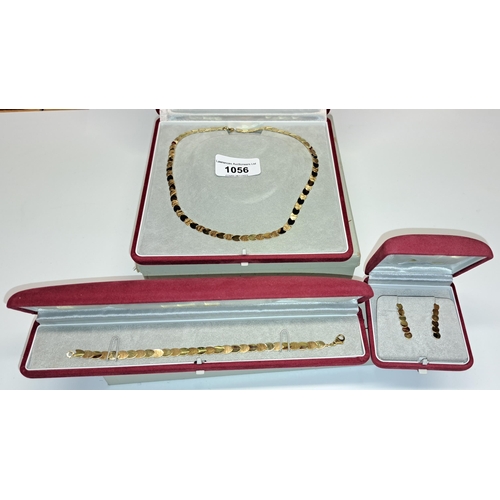 1056 - 9ct Gold necklet with matching bracelet and a pair of ear drops of heart design, 15.5g total