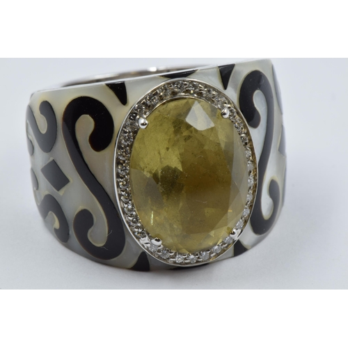 1061 - New Italian Art, 18ct white gold dress ring set with an oval lemon citrine surrounded by diamonds, t... 