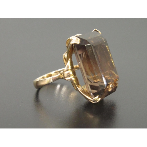 1064 - 9ct Gold dress ring set smoky quartz, size J, 9.2g