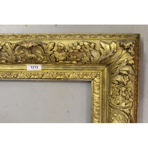 1212 - Rectangular gilt wood picture frame, aperture 40 x 29cm