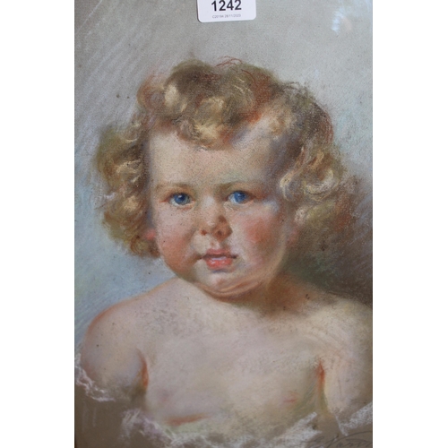 1242 - Pastel drawing, head and shoulder portrait of a child, indistinctly signed, 39 x 29cm, gilt framed t... 