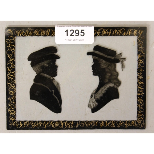 1295 - Reverse painted on glass silhouette picture of a young boy and girl in hats, unmounted, 10 x 14cm