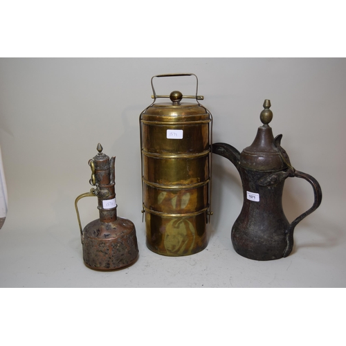 Antique Middle Eastern copper coffee pot, together with a smaller jug and a four section tiffin box