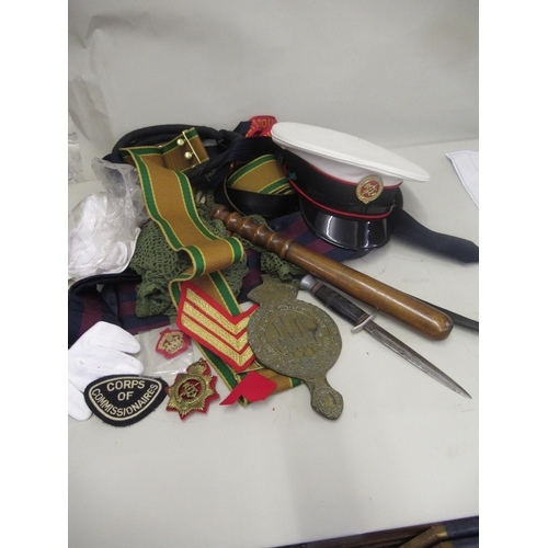 181 - Quantity of militaria to include a Commando dagger, Corps of Commissioners cap, various belts and sa... 