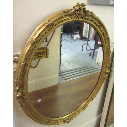 19th Century oval gilt framed wall mirror with decorative moulded frame, 95 x 78cm