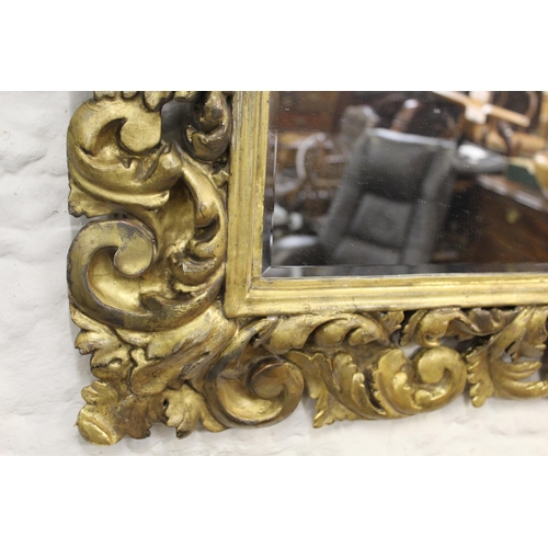 1942 - 19th Century Florentine carved and gilded rectangular cushion frame housing a later bevelled plate, ... 