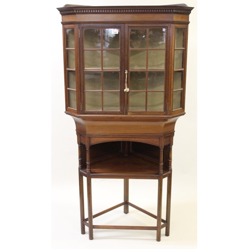 1946 - Liberty & Co. Ltd. mahogany standing corner cabinet of Arts and Crafts design, the upper section wit... 