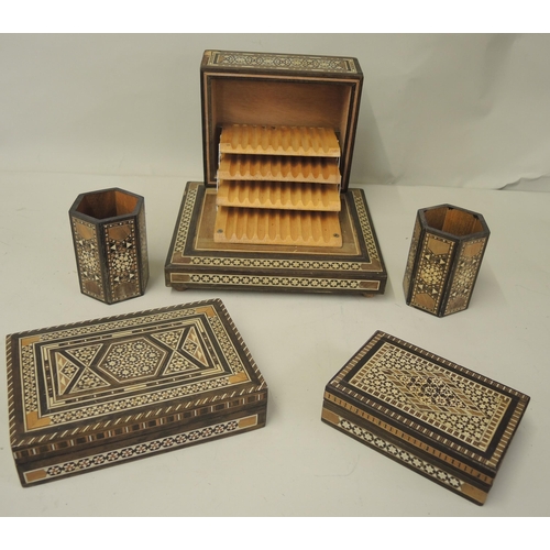 197 - Collection of Eastern inlaid boxes, pots etc. Including a musical cigarette box.