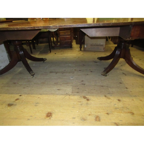 2037 - Large mahogany D-end pedestal dining table with two extra leaves, having turned columns and reeded s... 