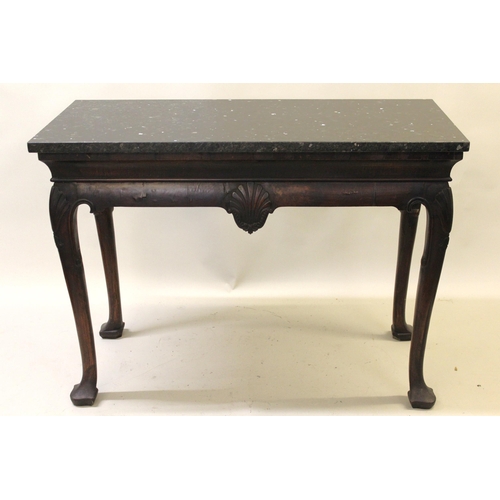 2039B - 19th Century Irish mahogany console table, the later composite marble top above centre carved shell,... 