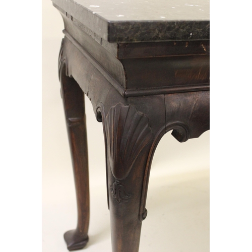 2039B - 19th Century Irish mahogany console table, the later composite marble top above centre carved shell,... 