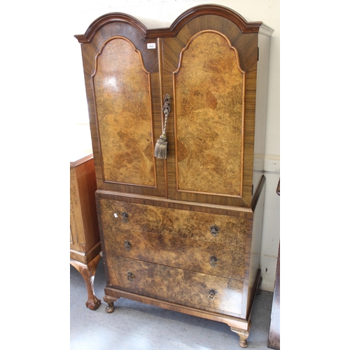 2042 - Mid 20th Century walnut linen press in Queen Anne style, the double dome top with two doors enclosin... 