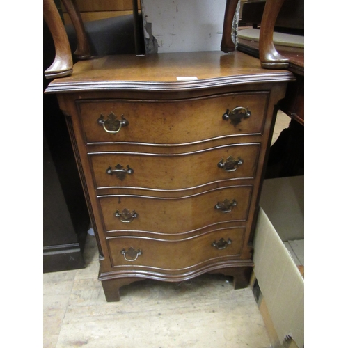 2044 - Reproduction figured walnut serpentine fronted four drawer bedside chest, together with another simi... 