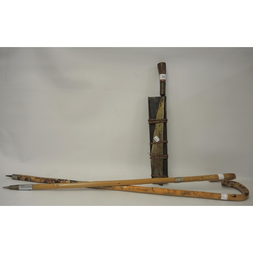 226 - Eastern Steel bladed machete with wooden handle, 49cm long, together with two bamboo walking canes