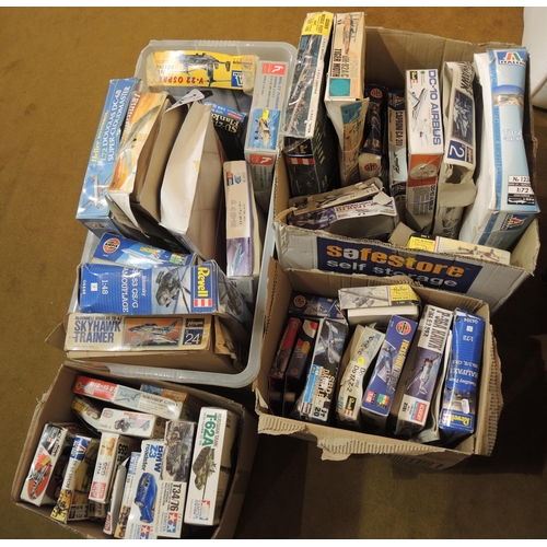 234 - Four boxes containing a large quantity of various model aircraft kits including Revel, Heller etc.