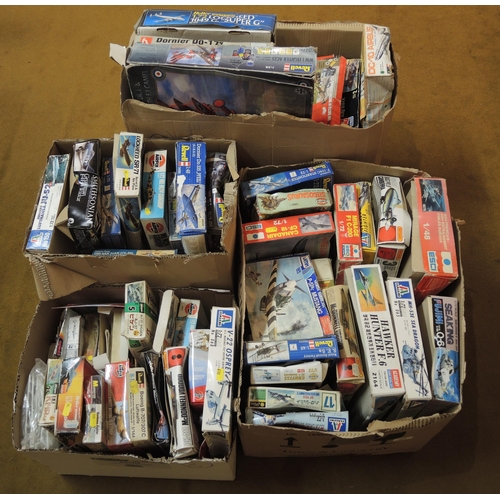 236 - Four boxes containing a large quantity of unmade model aircraft kits including Airfix, Revel, etc.