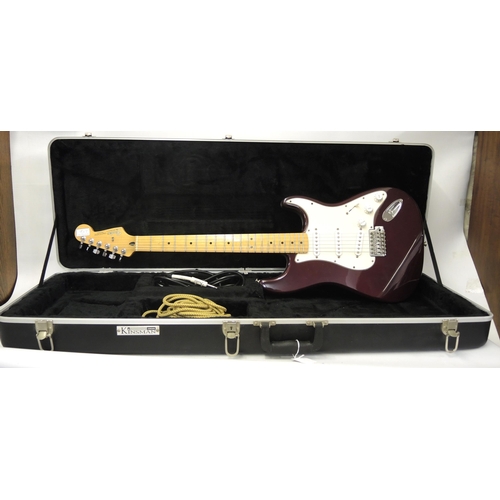 256 - Fender Stratocaster (made in Mexico) with a maple neck and fingerboard, deep red body, in a fitted c... 