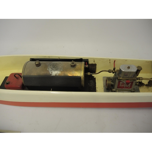 272 - Painted wooden model motorboat with live steam motor, 76cm long