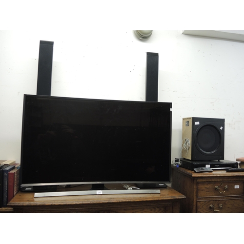 273 - Samsung UHD curved panel TV and a Panasonic DVD player with surround sound