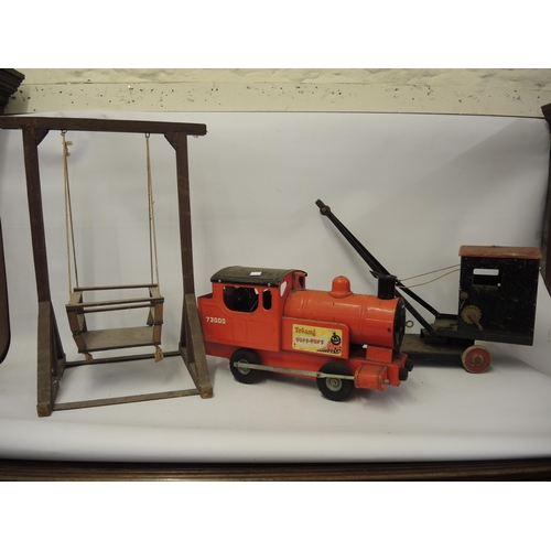 279 - Triang tin plate railway engine, a tin plate wooden crane and a dolls wooden swing