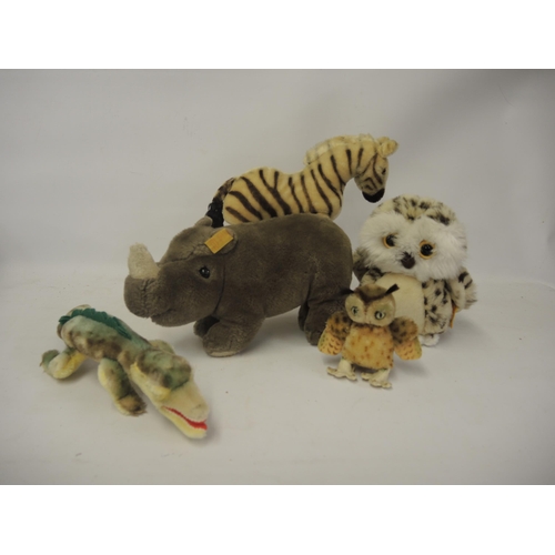 304 - Group of five Steiff soft toys including an alligator etc.