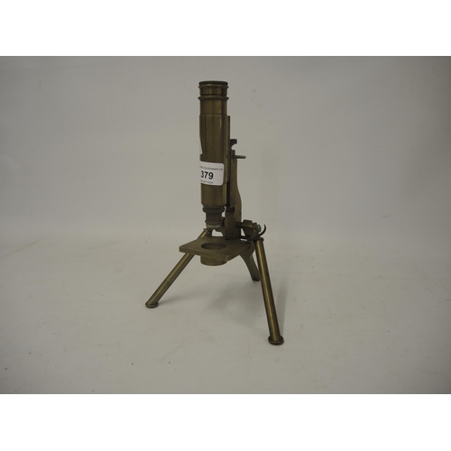 379 - C. Baker brass folding microscope (lacking box)