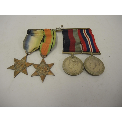 381 - World War II four medal group, including the Atlantic Star and 39 / 45 Star, all on a bar with ribbo... 