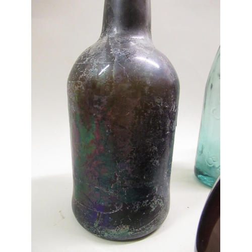 570 - Antique glass onion shaped wine bottle, 18cm high, together with four other various glass bottles