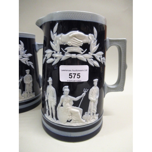 575 - Three Copland Pottery blue and white graduated stoneware jugs with various figures of soldiers, anot... 