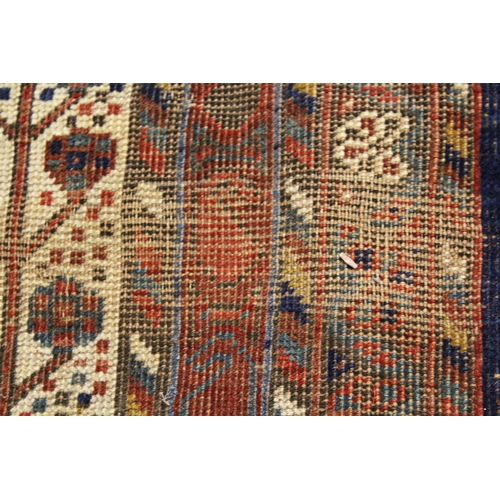 7 - Qashqai carpet with a triple medallion and all-over stylised flowerhead design on a red ground with ... 