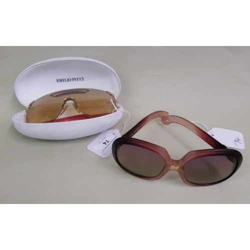 74 - Emilio Pucci, pair of sunglasses in original case, together with a pair of Nina Ricci sunglasses