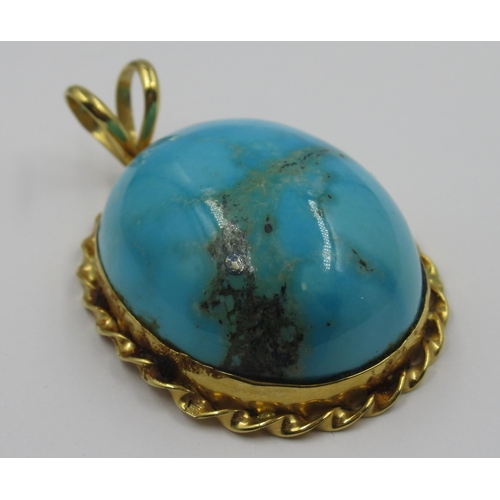 859 - Turquoise yellow metal mounted pendant with marks  (possibly Egyptian)