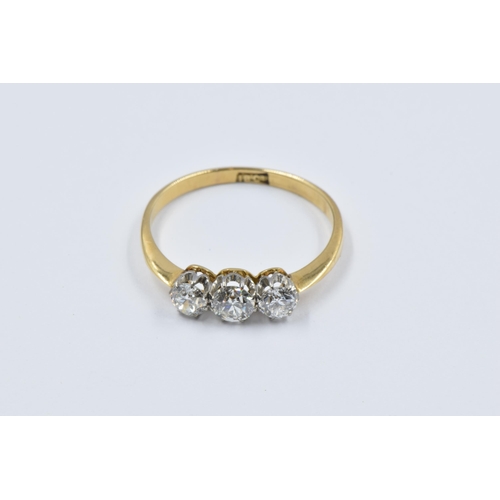 865 - 18ct Yellow gold three stone diamond ring