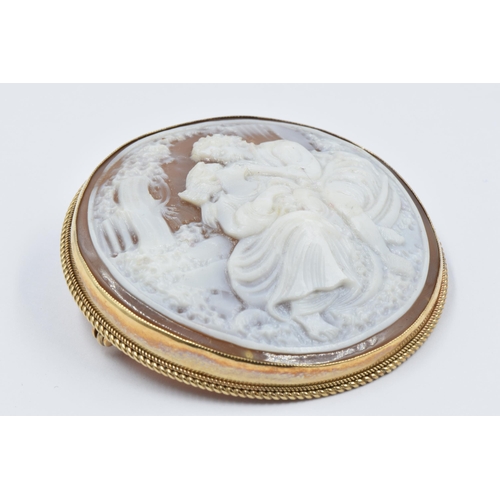 872 - Circular 9ct gold mounted carved shell cameo brooch, depicting 'The Lovers', 46mm diameter