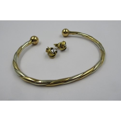 874 - 9ct Two colour gold bangle, 15.3g, together with similar pair of unmarked stud earrings